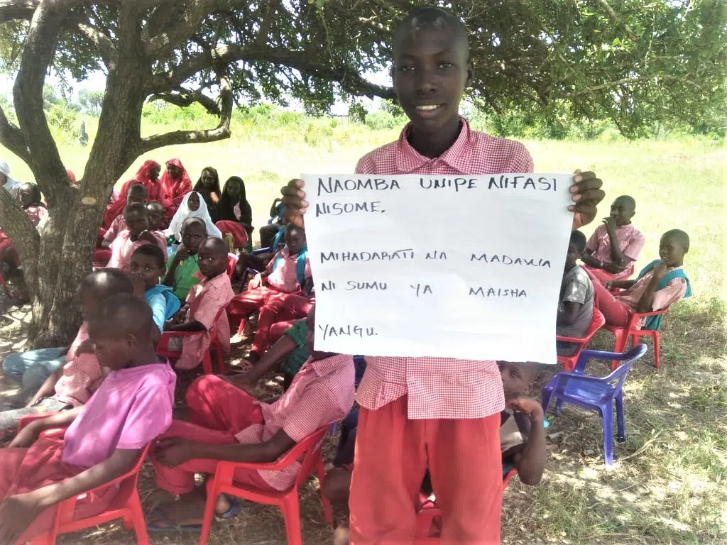 A group of kenyan boys learning in the classroom