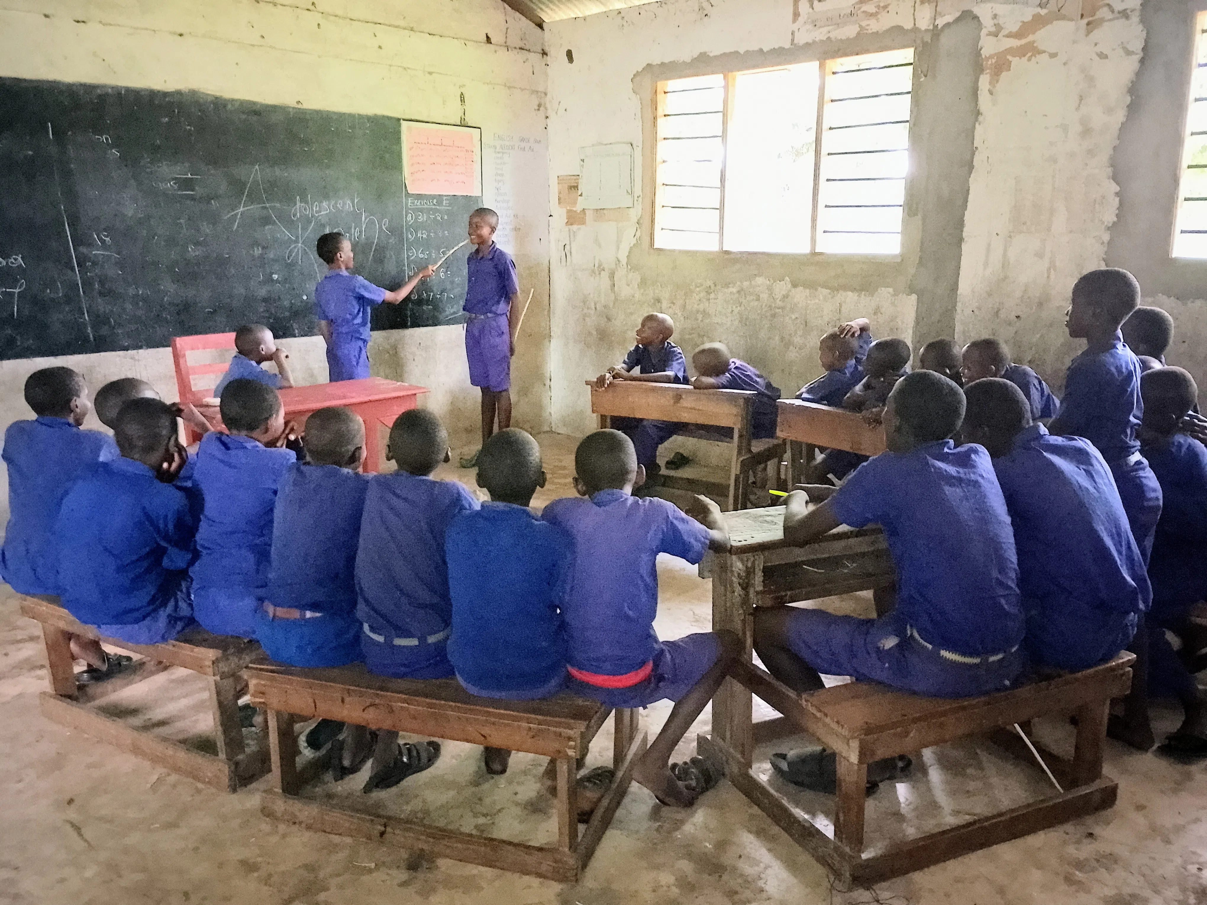 A group of kenyan boys learning in the classroom