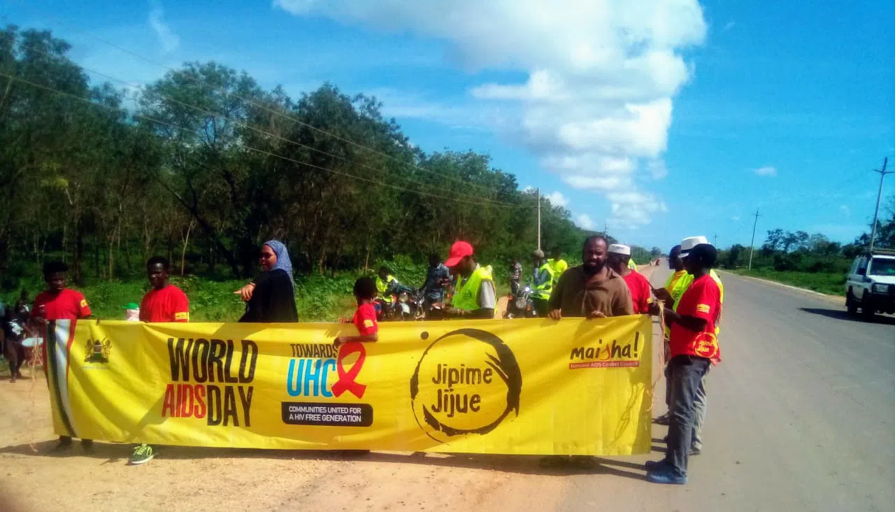 Boys girls and their teachers marching for world aids day