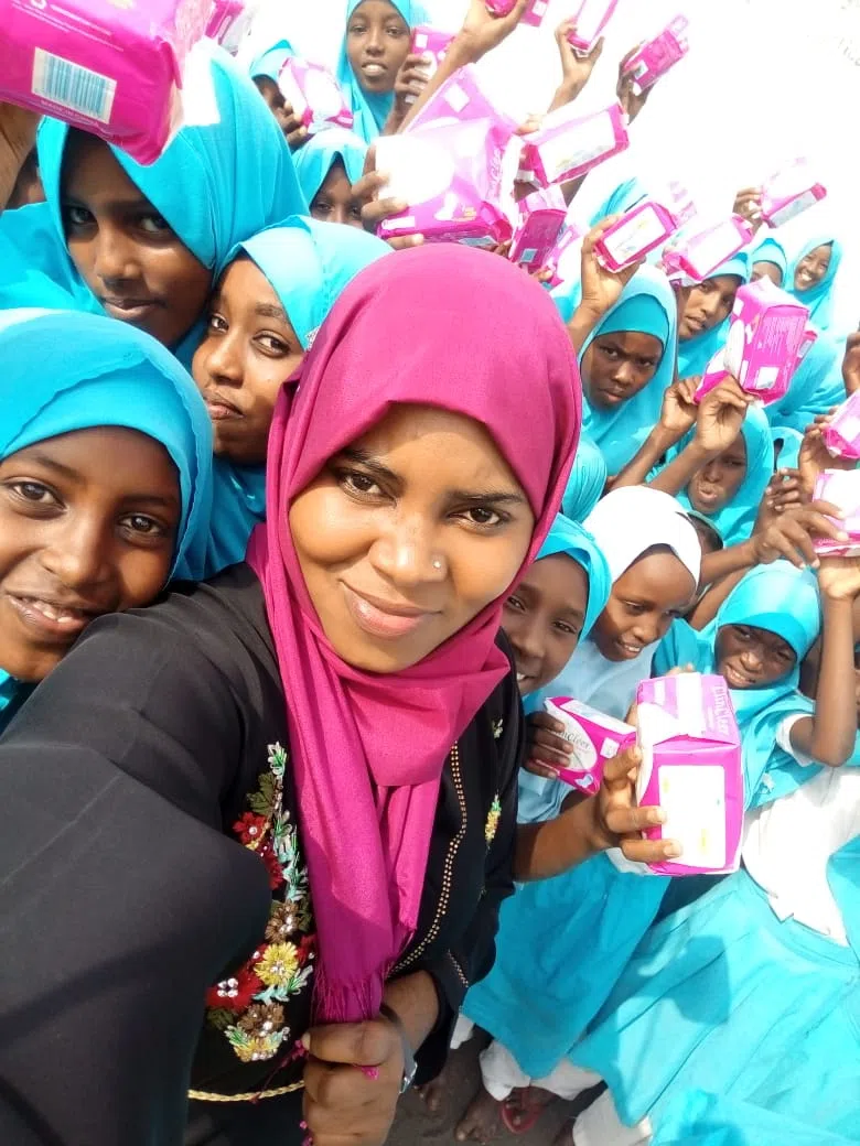 A teacher and her students holding pads